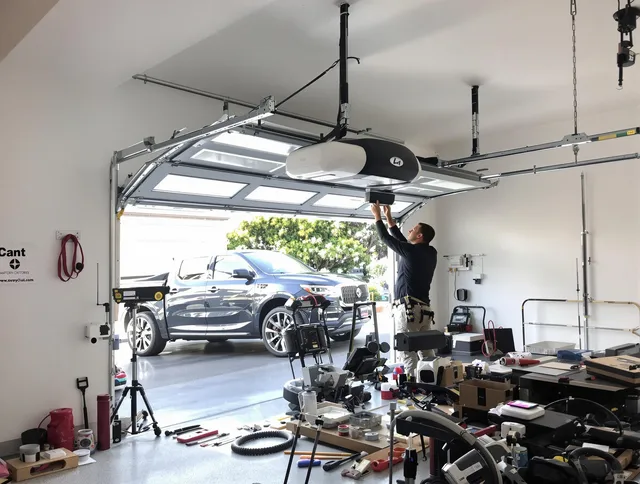 West Hartford Garage Door Repair specialist installing smart garage door opener system in West Hartford home