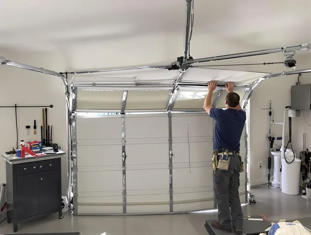 West Hartford Garage Door Repair specialist performing precise section replacement on West Hartford garage door